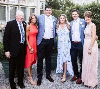 people smiling in formalwear